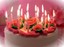 Gâteau anniversaire bougies allumées